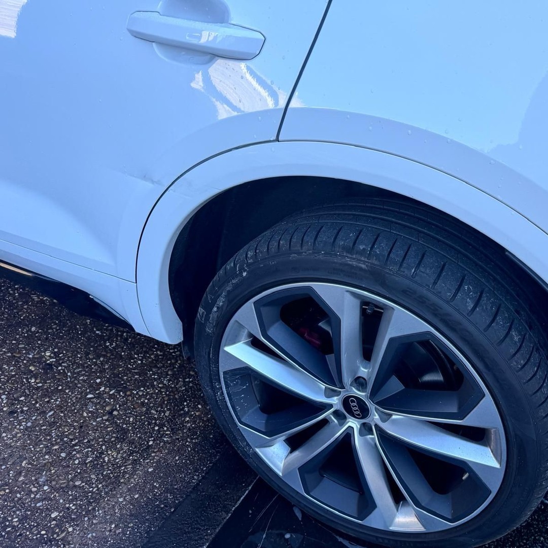 Rear view of blue Mini after repair and paint finish